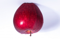 photograph of an upside down apple
