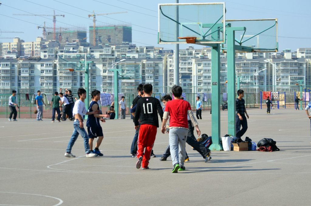 Photograph of kids playing basketball