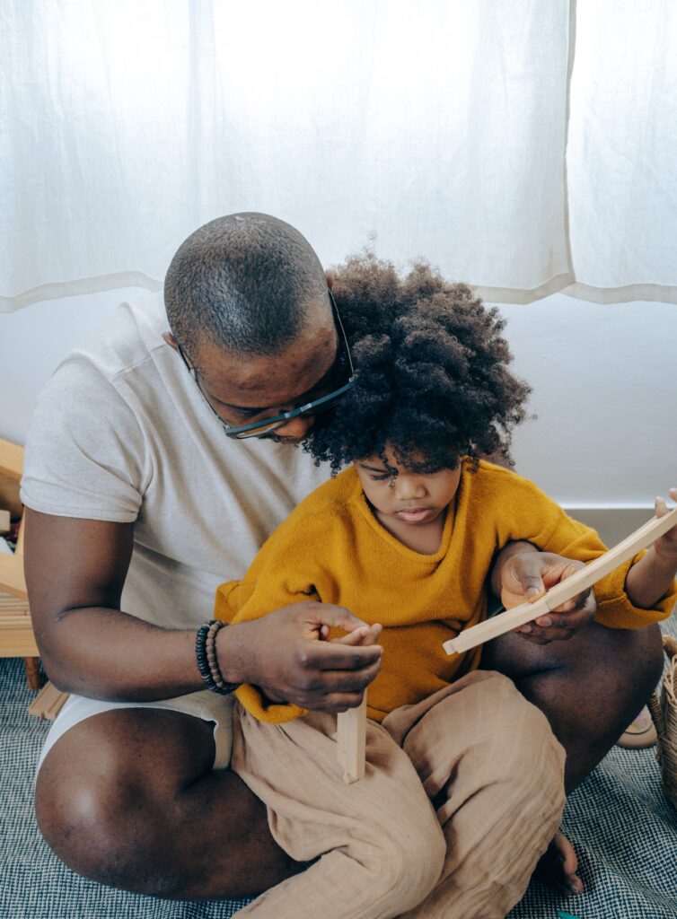 Photograph of adult reading to child
