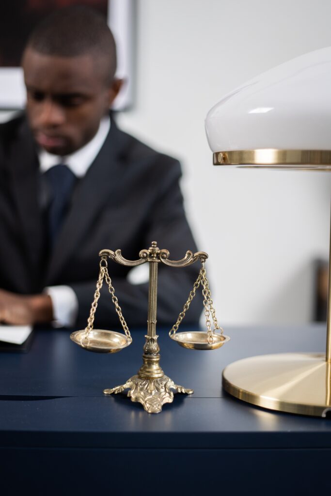 Figure 1 Photograph by Photo by Katerina Bolovsova: https://www.pexels.com/photo/brass-colored-balance-scale-on-a-lawyer-s-table-6077961/