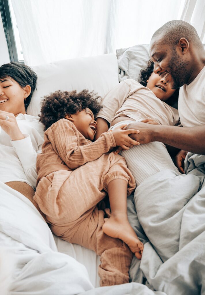 Figure 1 Photograph by Photo by Ketut Subiyanto: https://www.pexels.com/photo/happy-african-american-father-playing-with-children-on-bed-4545160/ CCO.